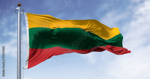 National flag of Lithuania waving in the wind on a clear day photo