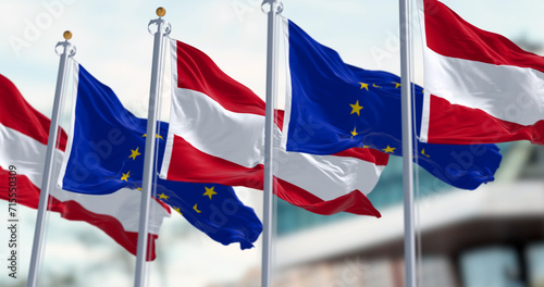 Austria and European Union flags waving together on a clear day