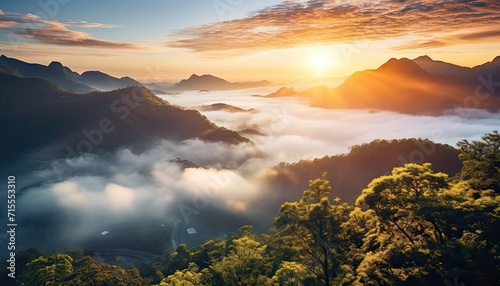 View of the sea of clouds from the top of the mountain peak. Tropical rainforest with vibrant morning reflection of the sunrise. © Virgo Studio Maple