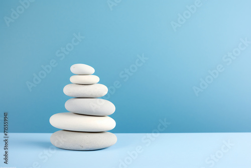 Zen Stone Stack on a Serene Blue Gradient Background. Balance and Harmony Concept