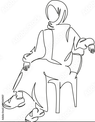 Muslim woman sitting on a chair