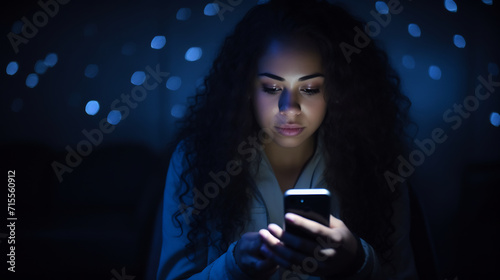 Teenage Girl Engrossed in Smartphone Screen in the Dark. Digital Connection Concept