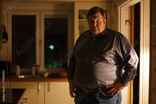 Man in Thoughtful Pose in Home Kitchen