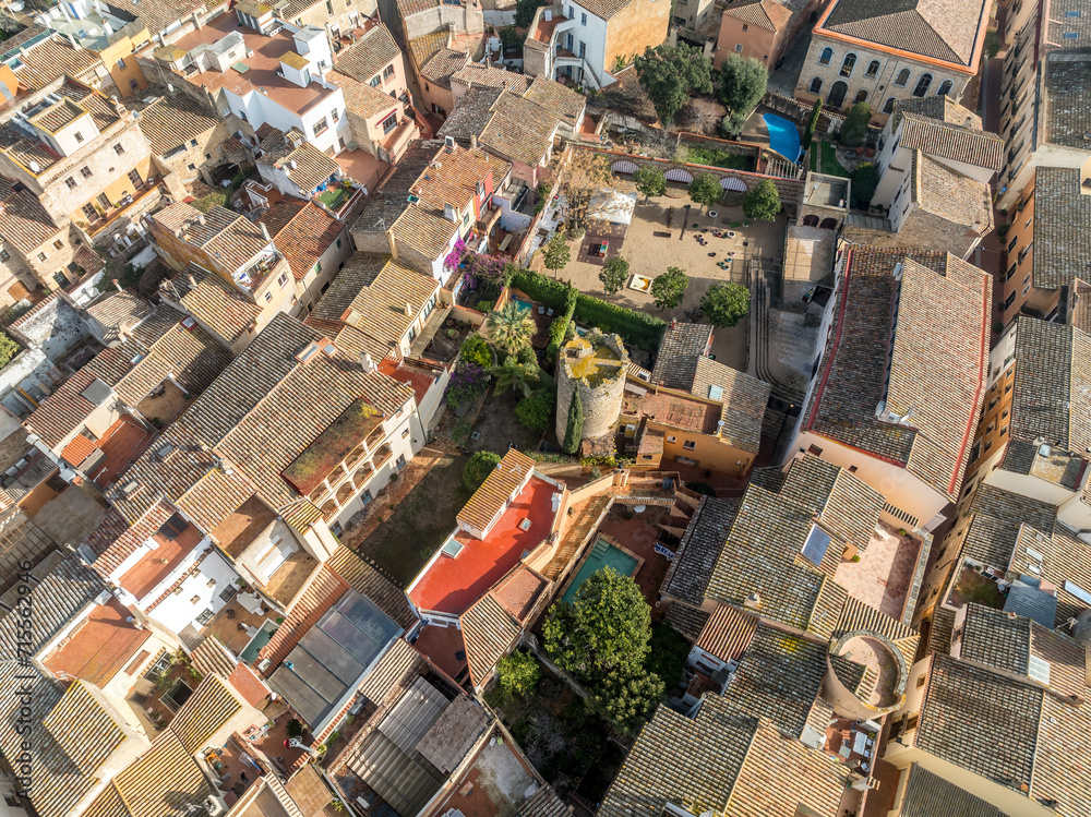 Aerial view of medieval town center in Begur Costa Brava Spain, with circular watch tower in the middle of a residential neighborhood built for watching for pirates