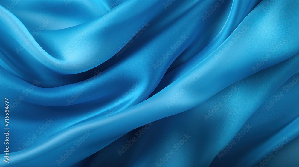 Obraz premium A vivid blue satin fabric with dynamic waves creates a luxurious and fluid texture, perfect for elegant backgrounds.
