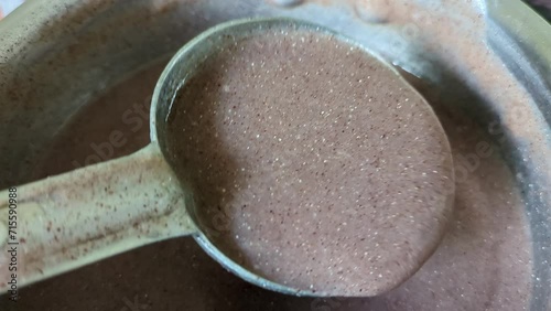 Preparing ragi malt a healthy finger millet porridge, an ultimate health food photo