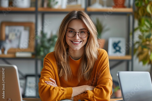 Young happy business woman smiling and looking at camera 