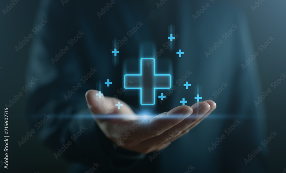 Businessman interacting with a blue plus sign, representing a mindset of positivity, mental health care, and insurance in mental rejuvenation, positive thinking mindset. Good, best. - obrazy, fototapety, plakaty 