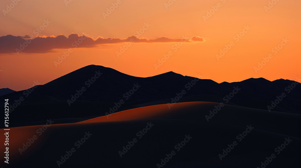 The majestic form of desert dunes against the twilight sky