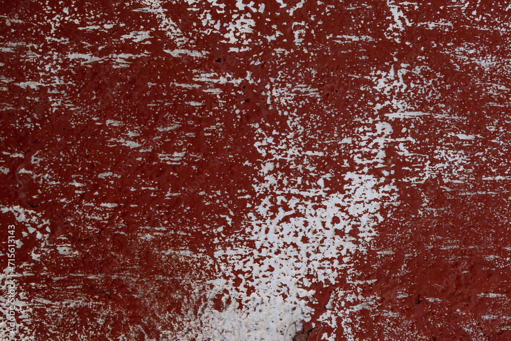 Texture of red colored old wall with worn out paint