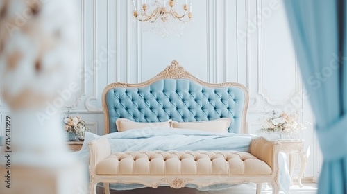 Bed in a luxury hotel room. Bedroom in blue tones in Victorian style. A luxurious escape from the hustle and bustle.
