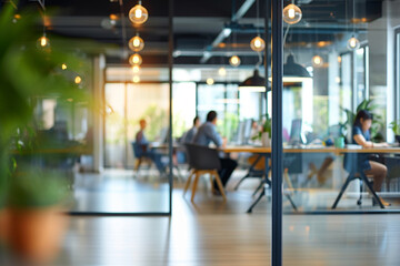 Business office interior with panoramic windows and beautiful lighting with blurred people casual wear.