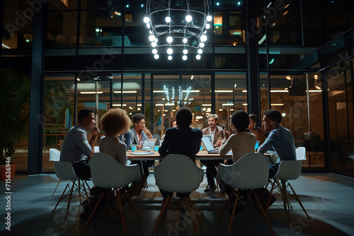 Group of multiethnic people meeting in conference hall at the night time.