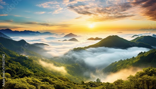 View of the sea of clouds from the top of the mountain peak. Tropical rainforest with vibrant morning reflection of the sunrise.