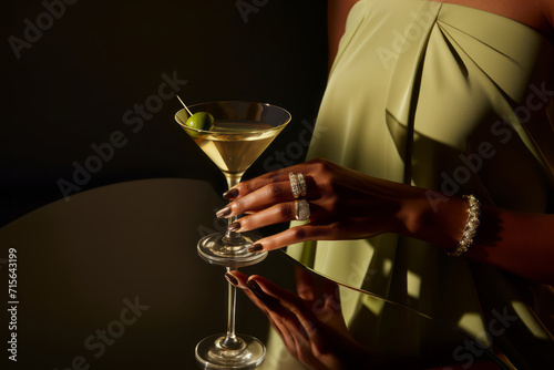 Woman's hand with martini glass