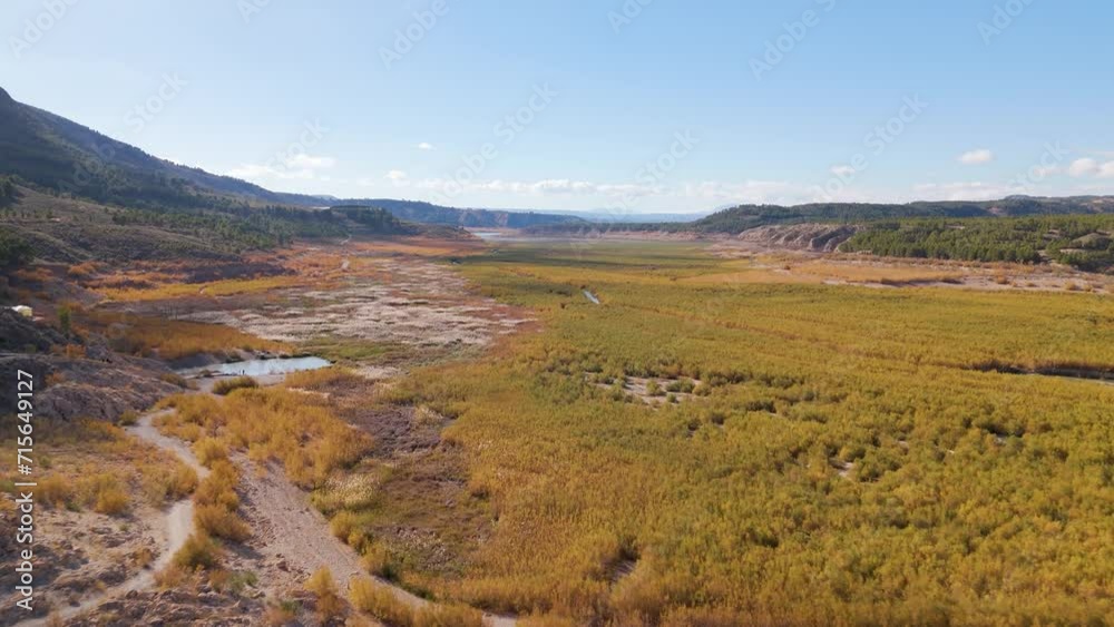 Aerial drone view on natural hotspring at lake Negratin in Spain.