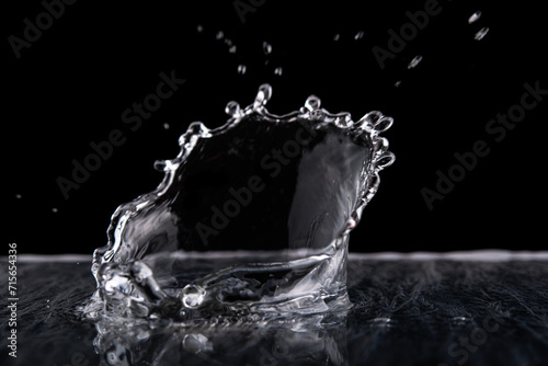 Water splash isolated on black background. Water texture.
