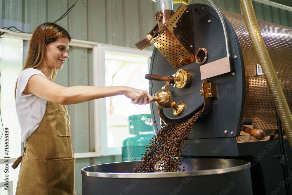 Professional coffee roaster working with modern automated roasting
