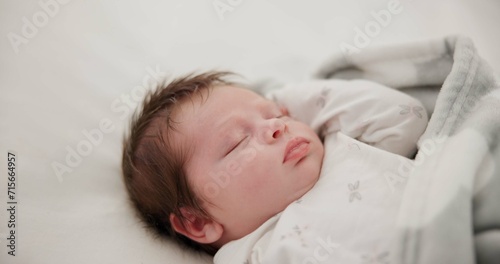 Baby, sleeping and nursery room bed with morning, nap and dreaming of a young newborn at home. Cozy, sleepy kid and calm with health development from rest and peace in a house with closeup and care