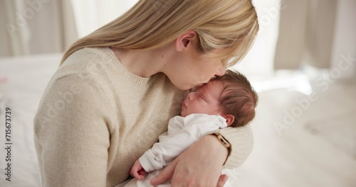 Bilde på lerret Family, kiss and a mom rocking her baby to sleep in the bedroom of their home together for love or care