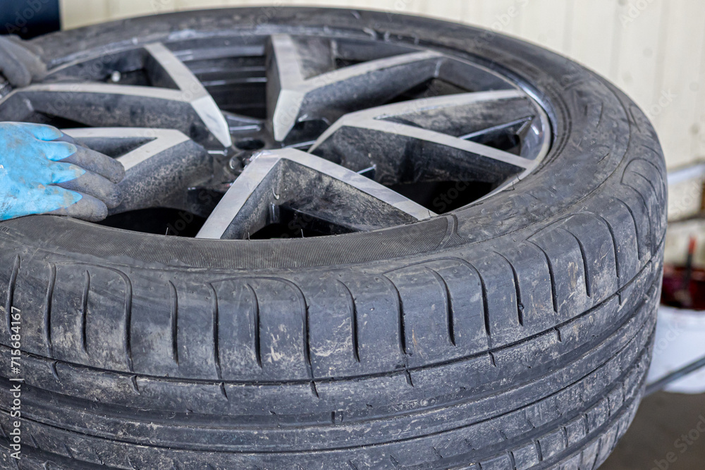 Tyre service. Compressed air tool. Changing the tyres on the car Tyre service. Compressed air tool. Changing the tyres on the car