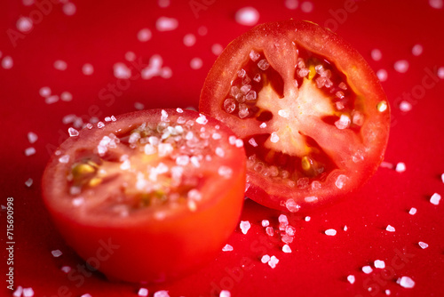 Tomatoes being sprinkled with salt.  © Sandie