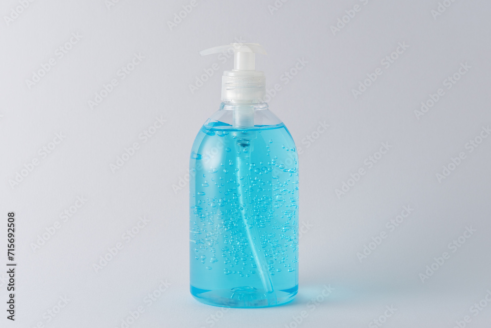 Hand sanitizer in a bottle on a bright background. Coronavirus prevention concept. Hand sanitizer in a bottle on a bright background. Coronavirus prevention concept.