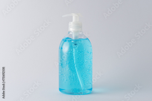 Hand sanitizer in a bottle on a bright background. Coronavirus prevention concept.