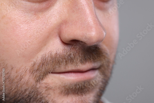 Closeup view of man with normal skin on grey background, space for text