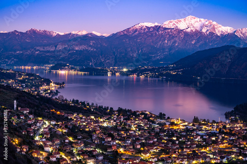 Panorama of Lake Como from Ossuccio, with Bellagio, the town of Ossuccio, and the Church of the Madonna del Socco, at dusk.