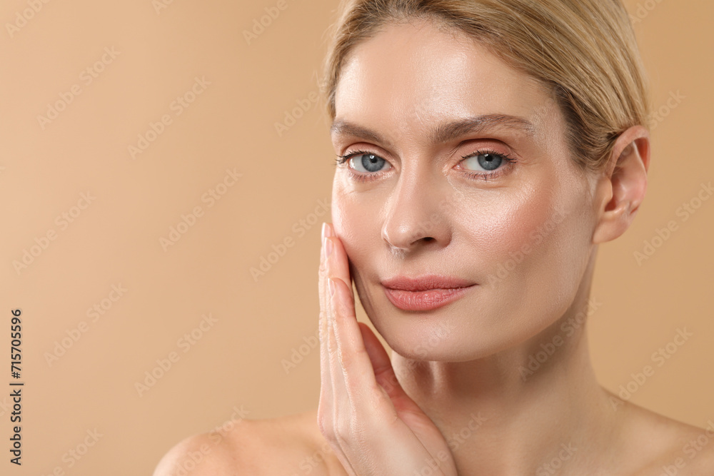 Beautiful woman with healthy skin on beige background, space for text Beautiful woman with healthy skin on beige background, space for text