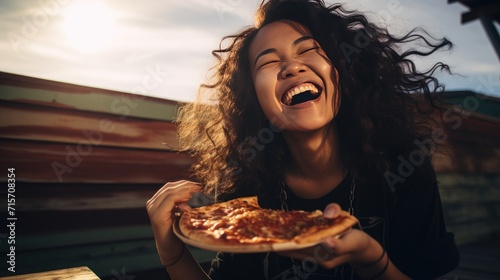 Beautiful woman eating pizza outdoor, enjoy quick meal on her day, teenage lifestyle