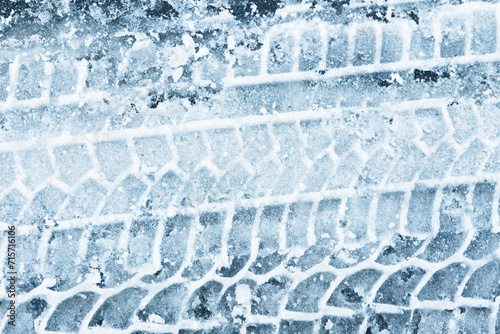 Wallpaper Mural Snow tyre mark. Asphalt covered in snow. Dangerous road conditions. Car imprint on frozen ground. Tire trail on ice. City streets covered in snow during heavy snow fall. Slippery road background. Torontodigital.ca