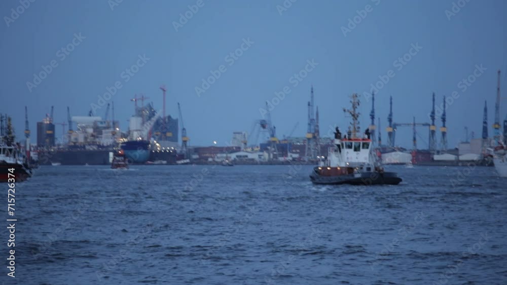 Container ships and cranes at dusk, Port of Hamburg, Germany