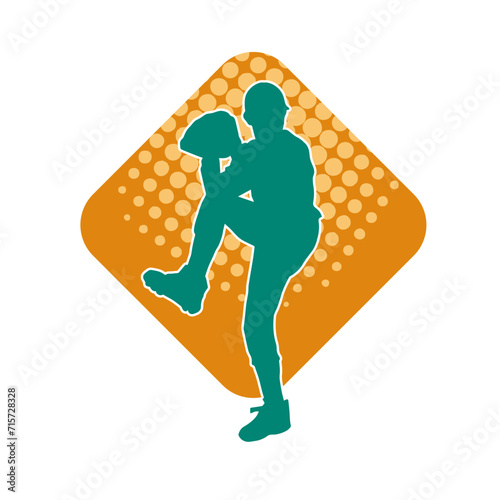 Silhouette of a baseball pitcher athlete ready to throw ball. Silhouette of male baseball pitcher in action pose.