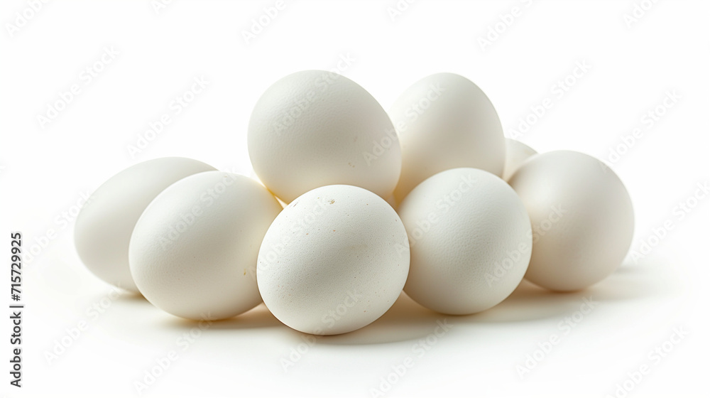 Isolated brown and white eggs, fresh from the farm, showcasing a group of three raw organic eggs with eggshells, a healthy breakfast ingredient