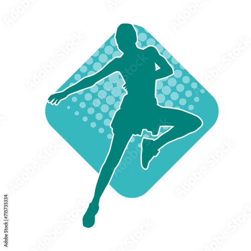 Silhouette of a slim female in dance pose. Silhouette of a woman dancing. photo