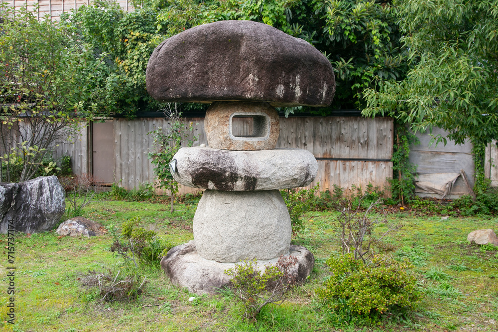 Traditional Japanese garden with a stone sculpture in a traditional tea house in the city of Murakami in Japan. Traditional Japanese garden with a stone sculpture in a traditional tea house in the city of Murakami in Japan.