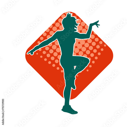 Silhouette of a slim female in dance pose. Silhouette of a woman dancing.