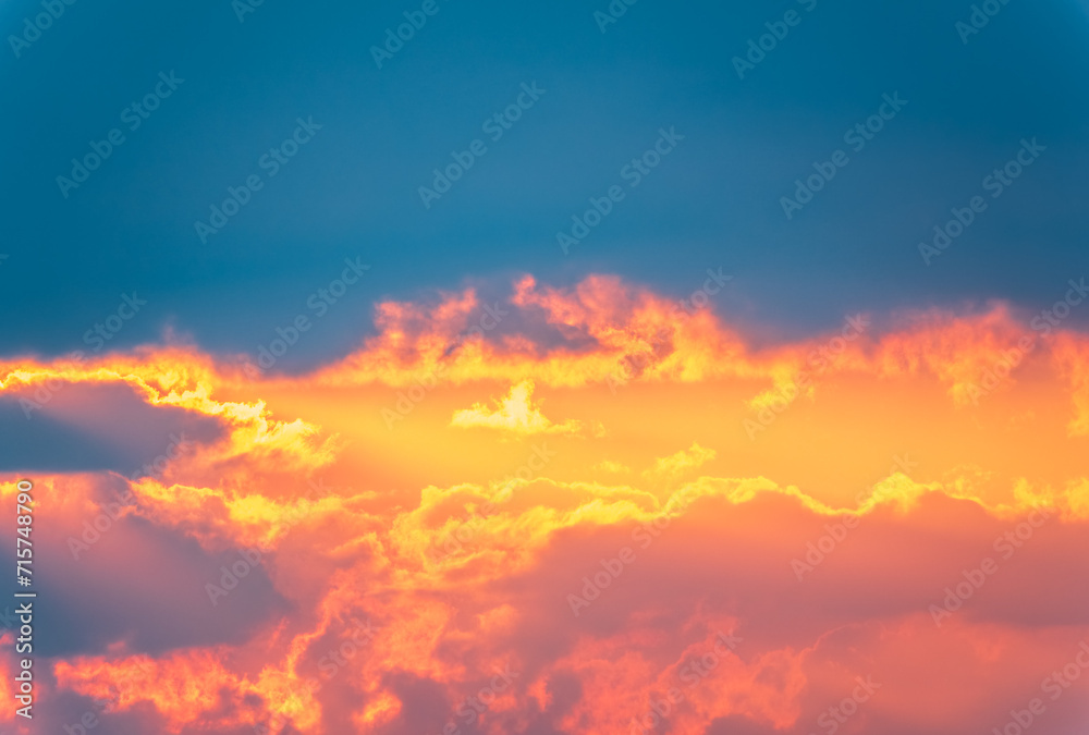 Dramatic cloudy sky background. Orange cloudy sunset sky.