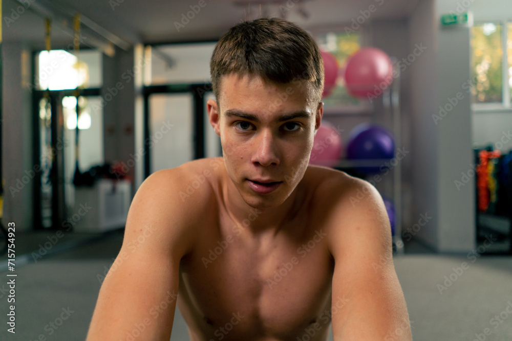 Obraz premium portrait of a tired sweaty sportsman resting in the gym after a hard workout motivation