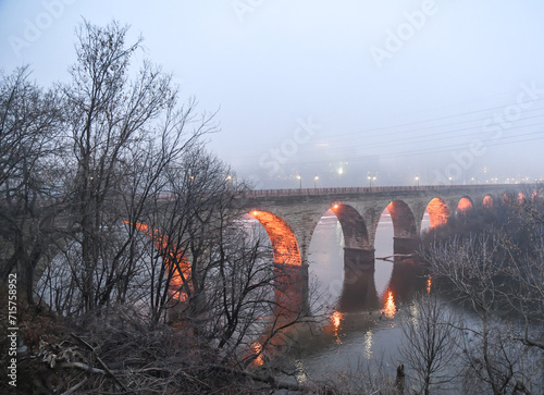 Old stone arch bridge across the Mississippi river 