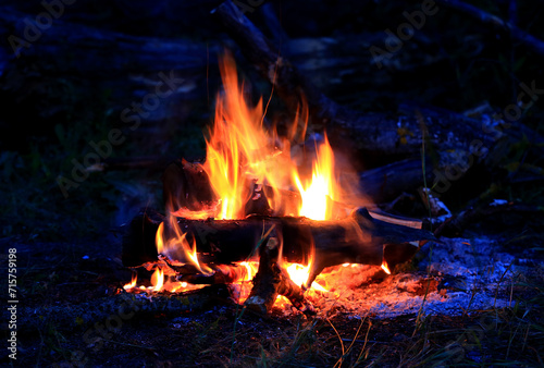 burning wood in dark