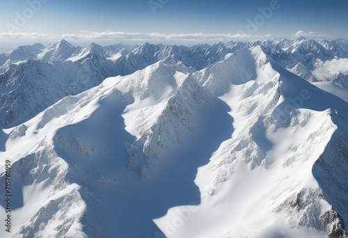 Snowy mountain peaks showcase majestic mountains blanketed in snow under a clear blue sky.