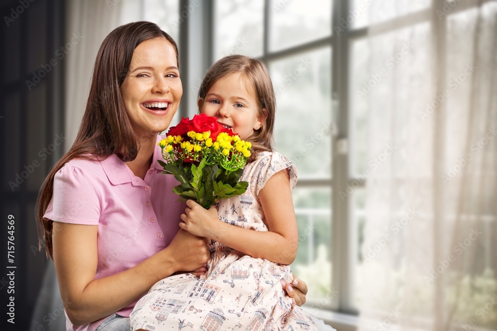 Happy Child congratulates mother and gives bouquet of flowers. Happy Child congratulates mother and gives bouquet of flowers.