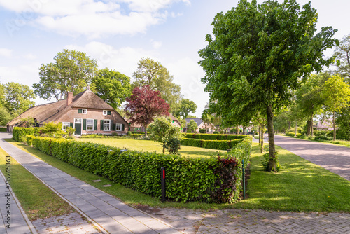 Street with characteristic farms in the rural village of Rouveen in the municipality of Staphorst in Overijssel. © Jan van der Wolf