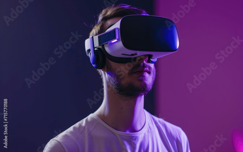 Young man embraces VR headset for futuristic experience. © OLGA