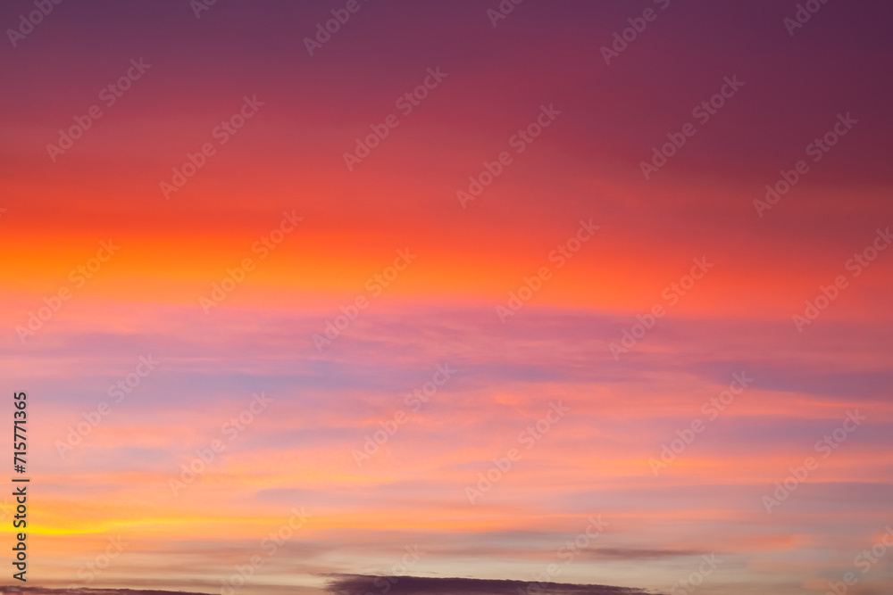 Bright orange sky with tints at sunset. Sky background