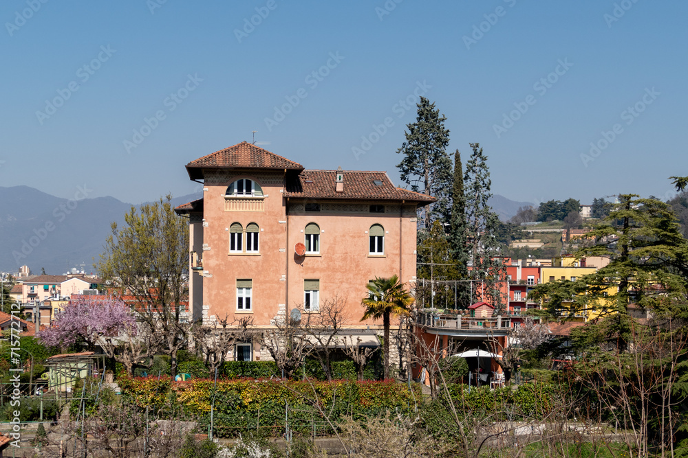 view to a traditional historic family house from the last century made of solid bricks in Brescia