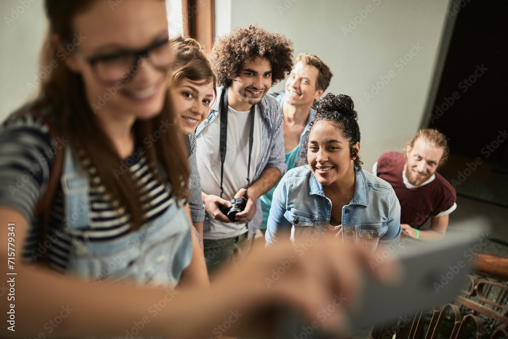 Group of young friends taking a selfie together Group of young friends taking a selfie together